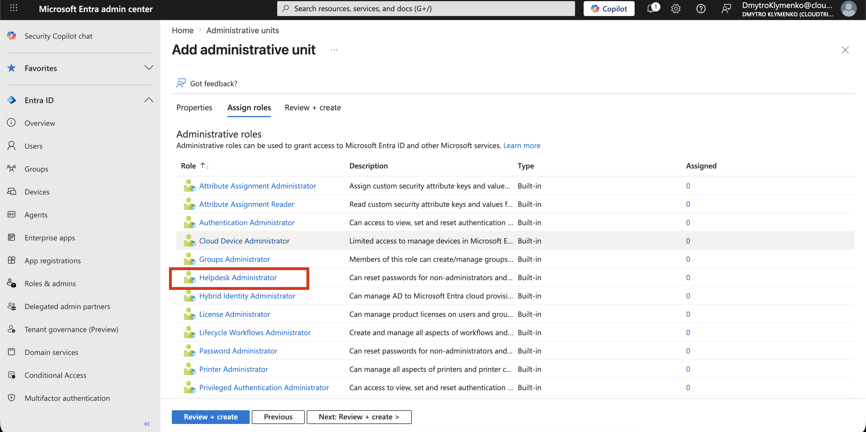 Microsoft Entra role selection screen showing available directory roles with Helpdesk Administrator highlighted